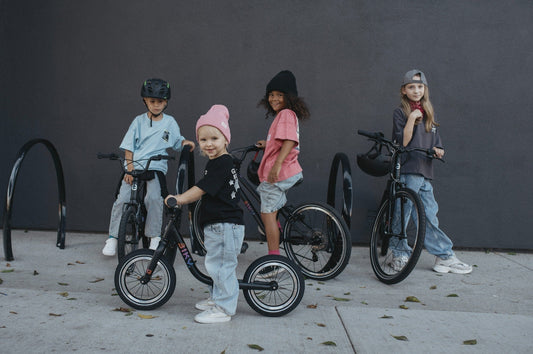 Kids with Biky bikes in different wheel sizes